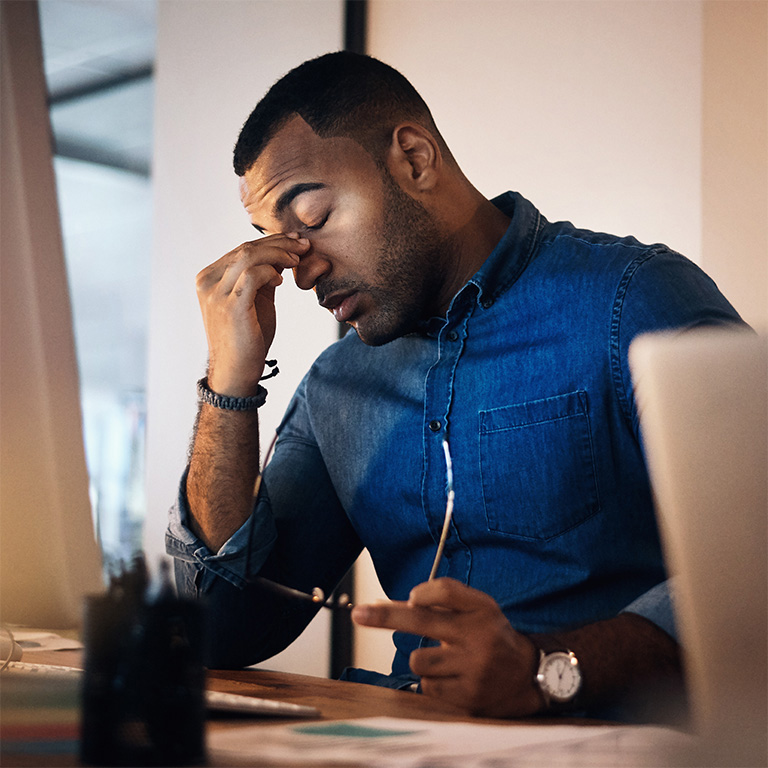 Migraine, burnout and businessman working in office at night with computer for corporate research