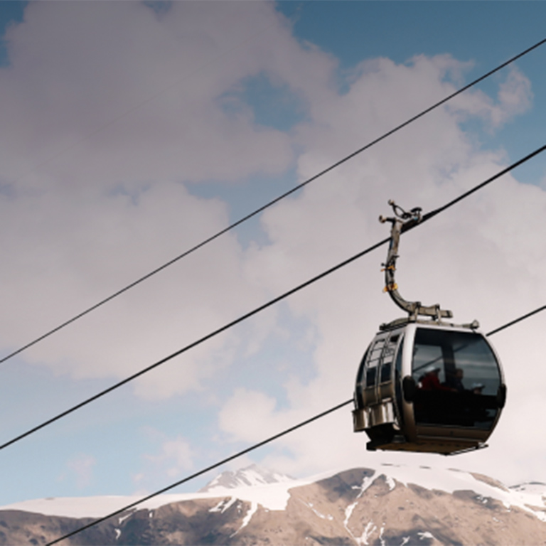 Cable cars gliding in the mountains