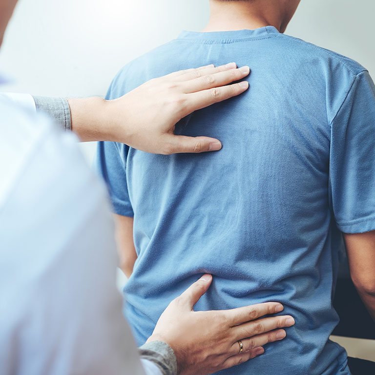 Doctor consulting with patient Back problems Physical therapy concept