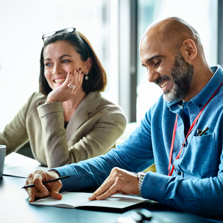 Smiling mature business man during meeting in office