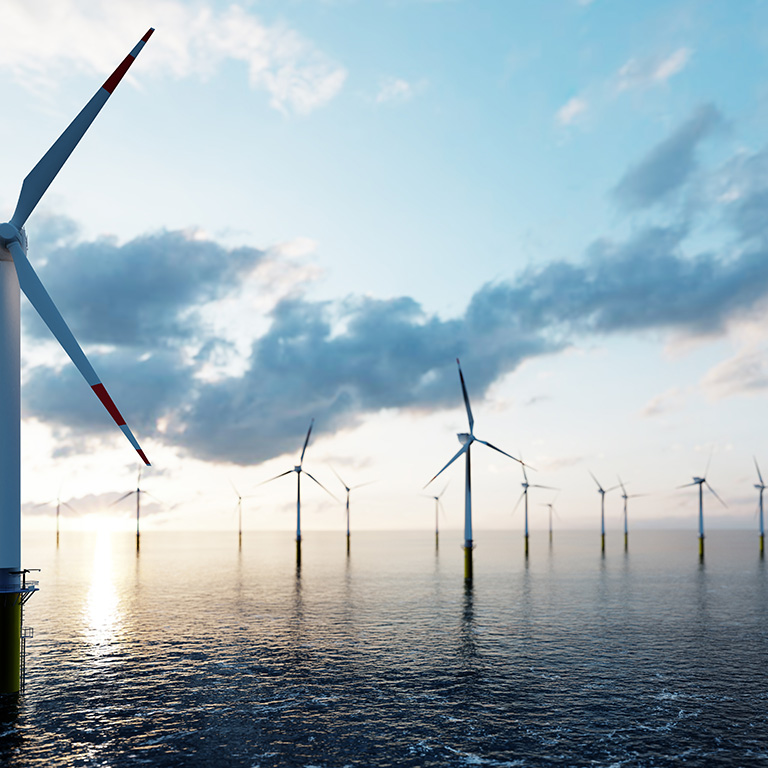 Offshore wind turbines farm on the ocean. Sustainable energy production, clean power.