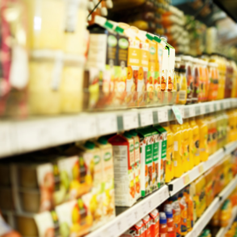 Image of shelves with different grocery products in the supermarket